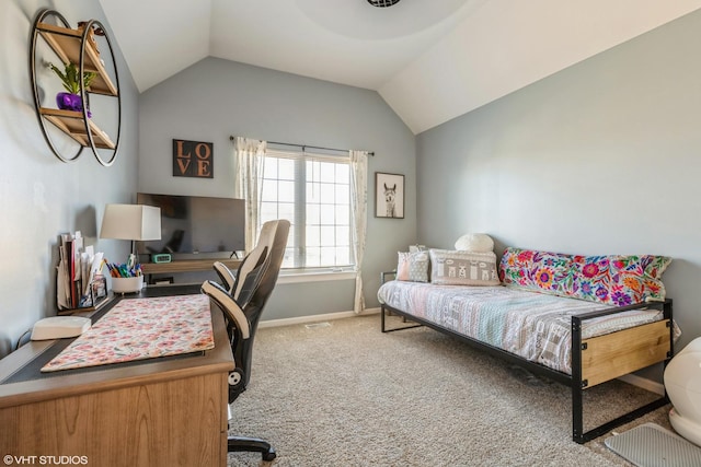 home office featuring lofted ceiling, carpet flooring, and baseboards