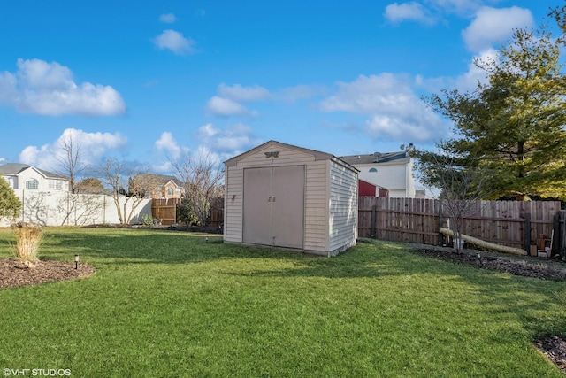 view of shed featuring a fenced backyard