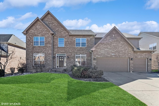 traditional-style house with brick siding, driveway, an attached garage, and a front lawn