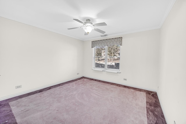 carpeted empty room with baseboards, crown molding, and ceiling fan