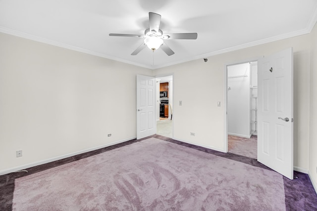 unfurnished bedroom with carpet flooring, baseboards, and ornamental molding