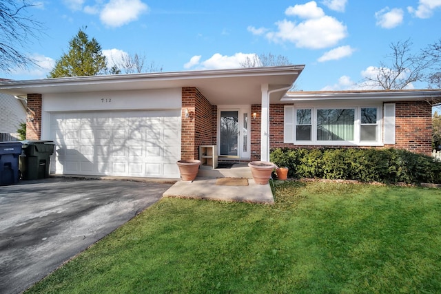 ranch-style home featuring a front yard, brick siding, driveway, and an attached garage