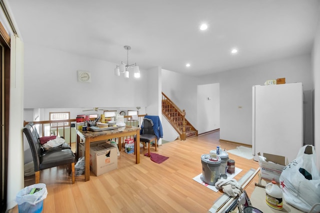 office featuring ceiling fan with notable chandelier, recessed lighting, and wood finished floors