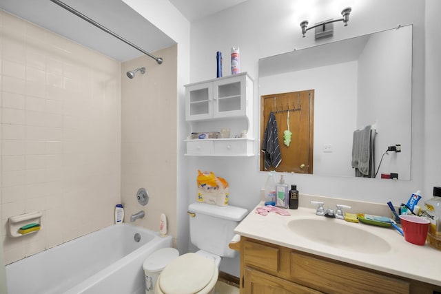 bathroom featuring shower / bathtub combination, vanity, and toilet