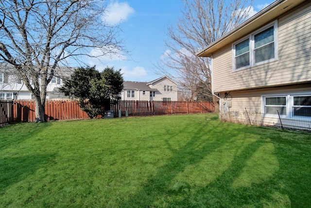 view of yard with a fenced backyard