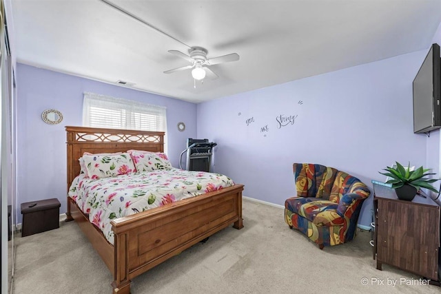 bedroom with a ceiling fan, baseboards, visible vents, and carpet flooring