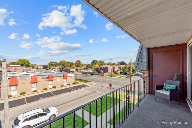 balcony featuring a residential view