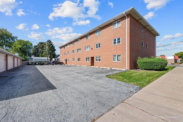 view of property with community garages