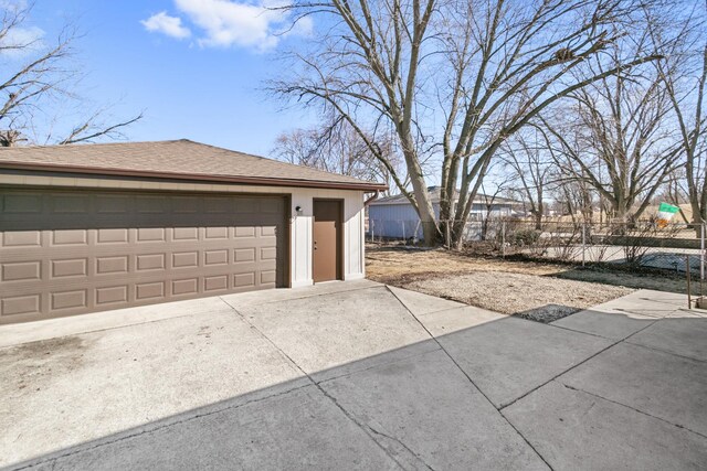 garage featuring fence