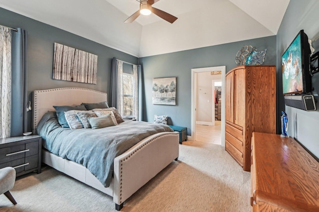 carpeted bedroom with baseboards, lofted ceiling, and a ceiling fan