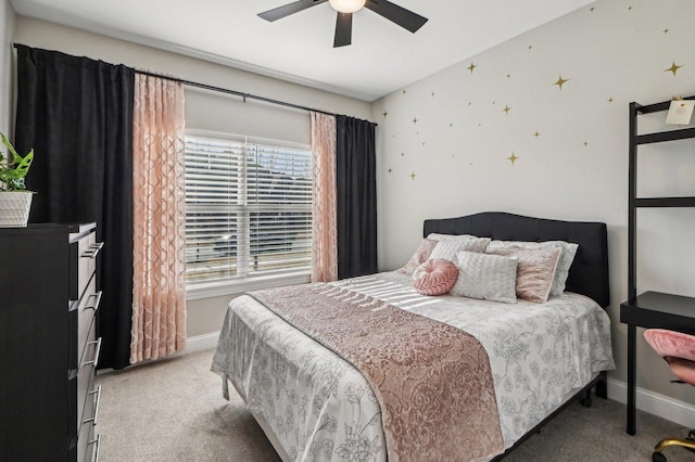 bedroom with light colored carpet, a ceiling fan, and baseboards