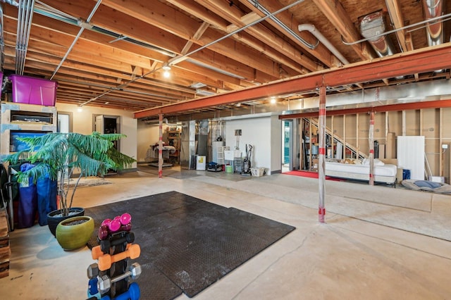 unfinished basement featuring gas water heater