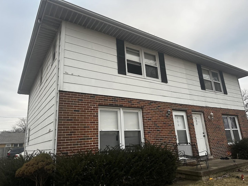 view of front of property featuring brick siding