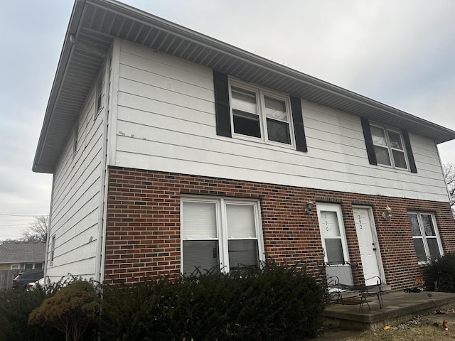 view of front of property featuring brick siding