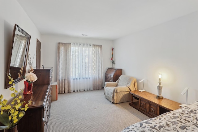 bedroom with visible vents and carpet floors