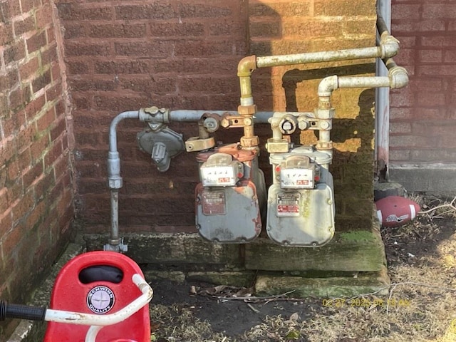 details with gas meter and brick siding