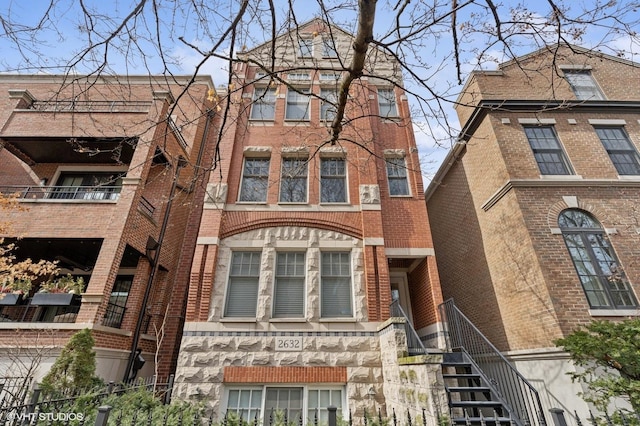 view of front of house featuring brick siding