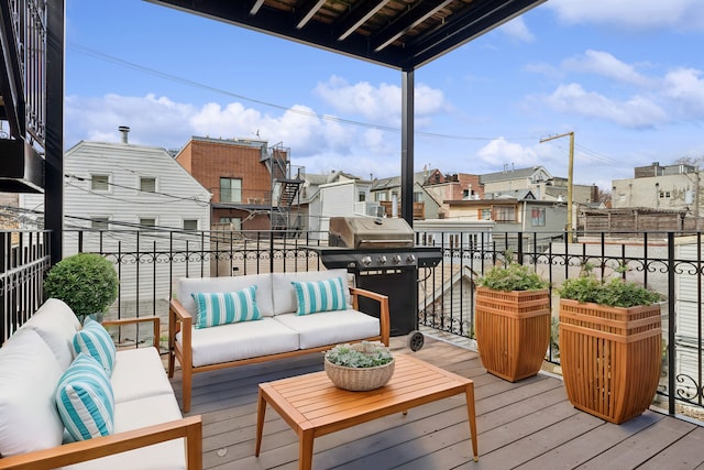 deck featuring a grill, a residential view, and an outdoor hangout area