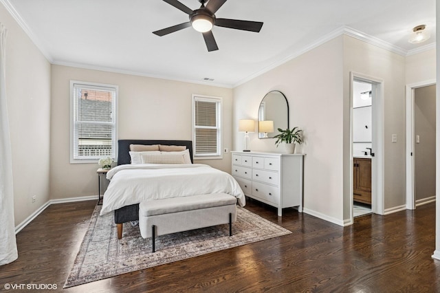 bedroom with ornamental molding, connected bathroom, baseboards, and wood finished floors