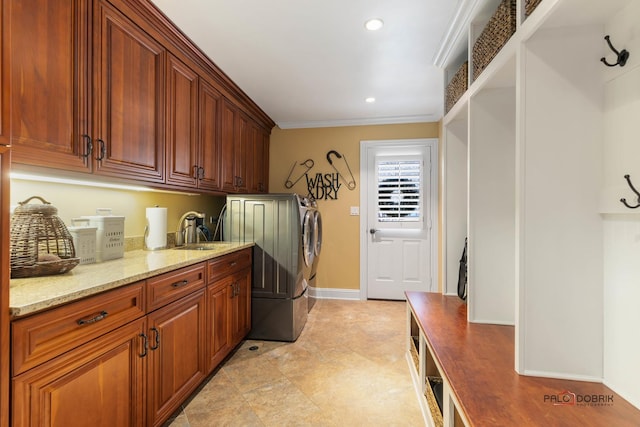 washroom featuring baseboards, recessed lighting, cabinet space, a sink, and ornamental molding