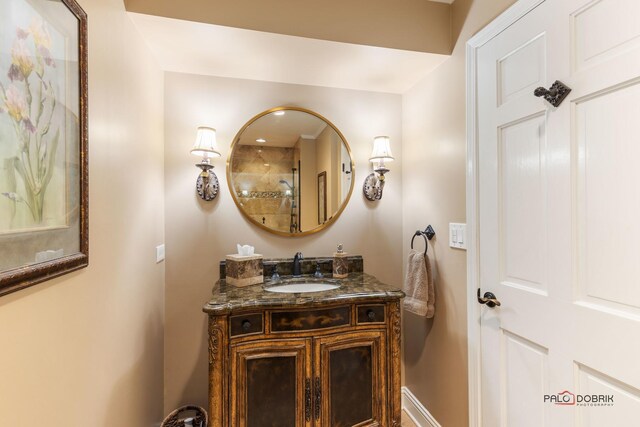 bathroom with vanity and baseboards