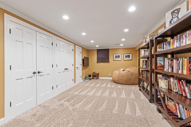 sitting room with recessed lighting, baseboards, carpet, and crown molding