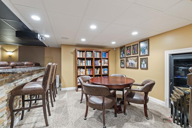 carpeted dining room featuring recessed lighting and baseboards