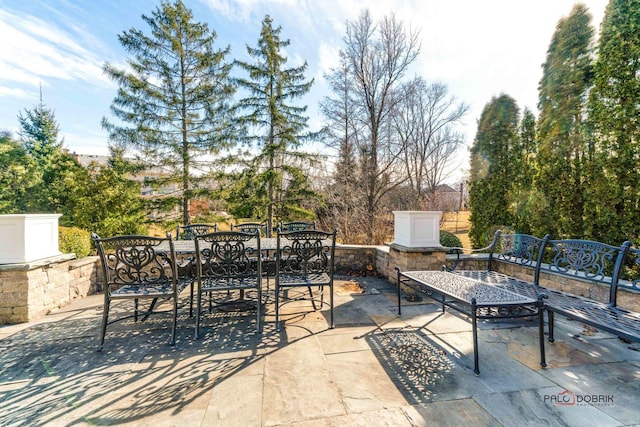 view of patio featuring outdoor dining area