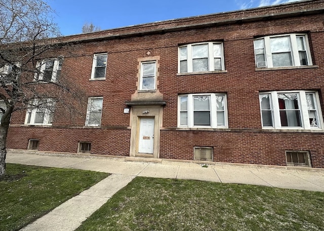 exterior space with brick siding