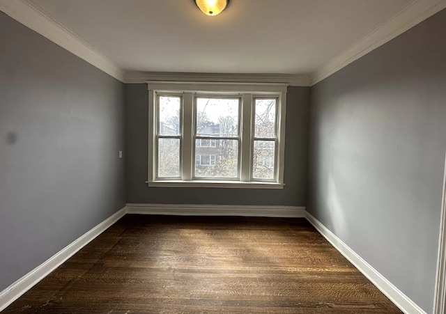 unfurnished room featuring baseboards, dark wood-type flooring, and ornamental molding