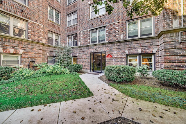 entrance to property with brick siding