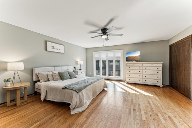 bedroom with wood finished floors and a ceiling fan