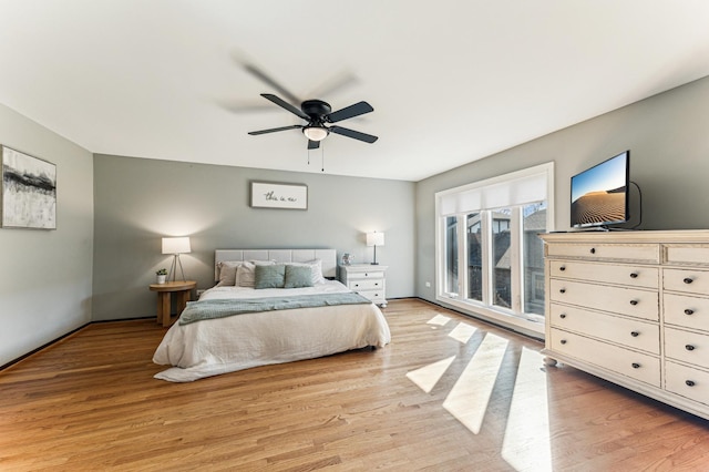 bedroom featuring ceiling fan and light wood finished floors