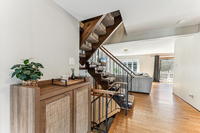 stairs with wood finished floors