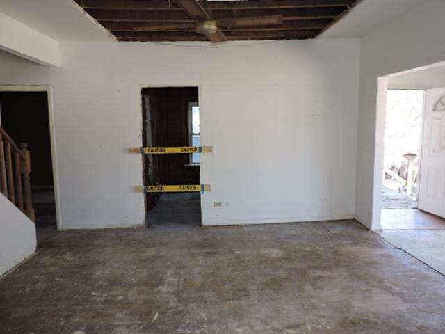 interior space with stairway and concrete flooring