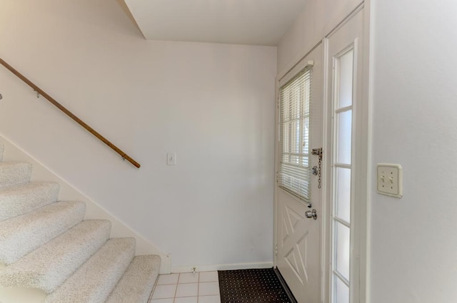 entryway with stairs and baseboards