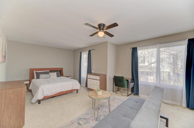 bedroom with carpet floors, a ceiling fan, and baseboards