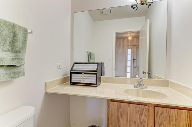 bathroom with vanity and toilet