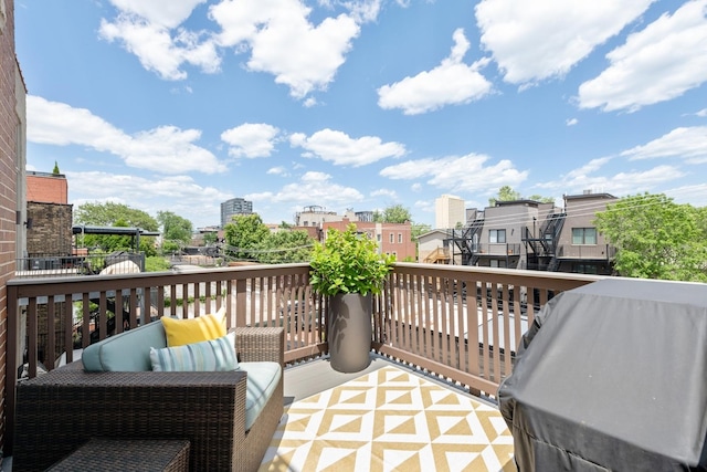 balcony featuring grilling area and a city view