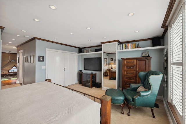 bedroom with a closet, crown molding, and recessed lighting