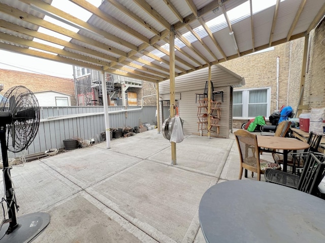 view of patio / terrace featuring fence, outdoor dining area, and a pergola