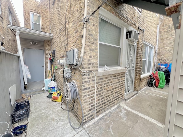 view of patio featuring a wall mounted AC