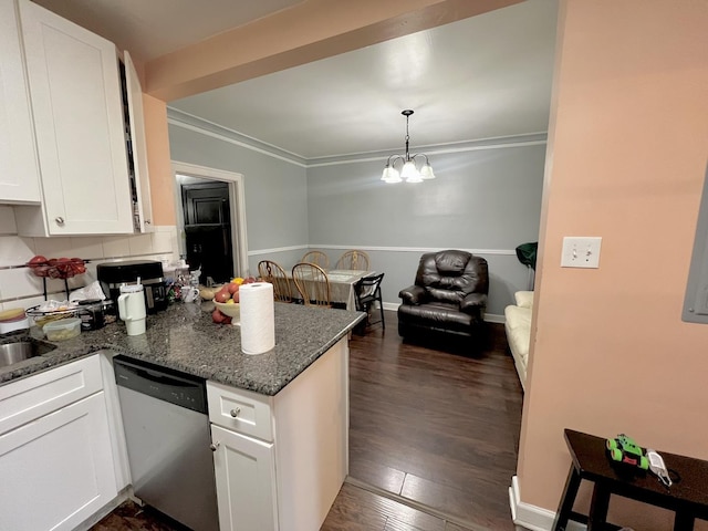 kitchen with a chandelier, a peninsula, white cabinetry, stainless steel dishwasher, and dark wood-style floors