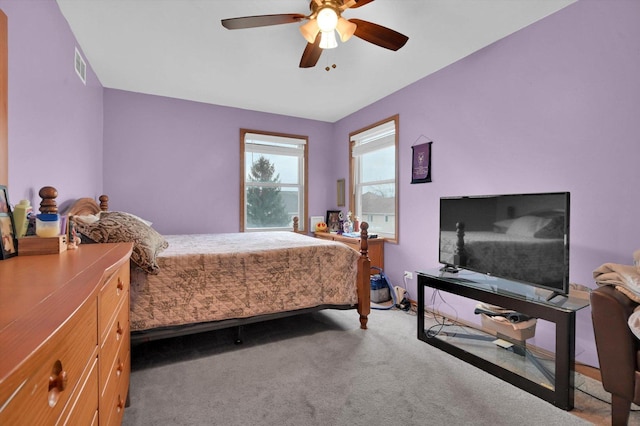 bedroom featuring carpet floors, ceiling fan, and visible vents