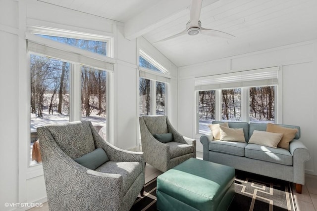 sunroom with vaulted ceiling with beams, ceiling fan, and a healthy amount of sunlight