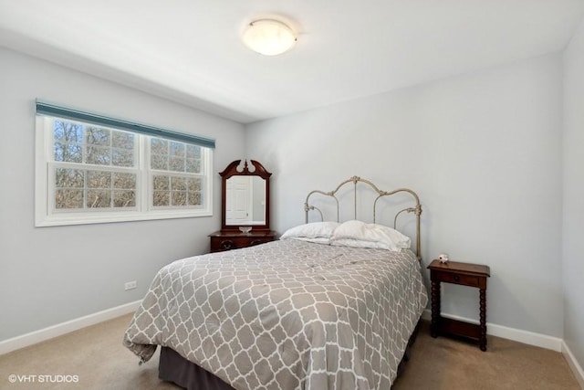 bedroom with baseboards and carpet flooring