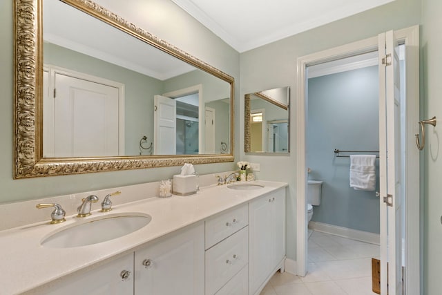 full bath featuring ornamental molding, a sink, toilet, and tile patterned floors