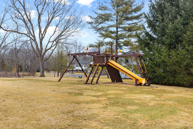 view of jungle gym featuring a lawn