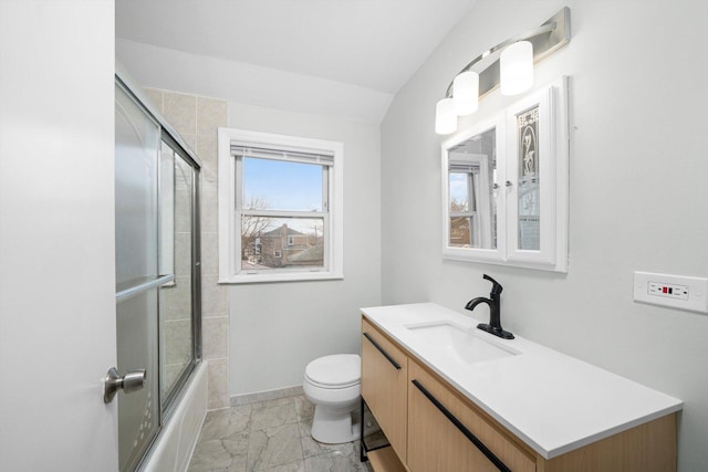 full bath featuring baseboards, toilet, shower / bath combination with glass door, marble finish floor, and vanity