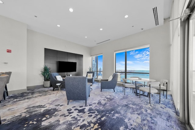 living room with baseboards and recessed lighting